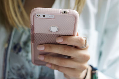 Close-up of man using mobile phone