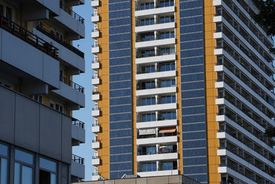 Low angle view of modern buildings in city against sky