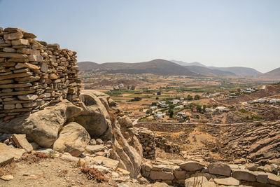 Stack of rocks against mountain range