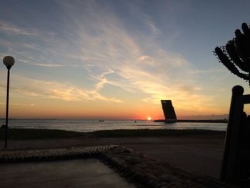 View of sea against cloudy sky during sunset