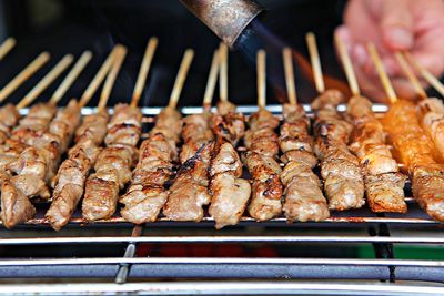 High angle view of meat on barbecue grill