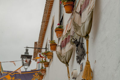 Clothes hanging against white wall