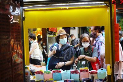 Group of people at market stall