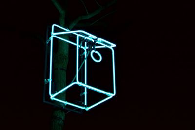Low angle view of illuminated lights at night