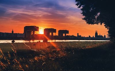 Silhouette of city during sunset
