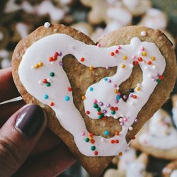 Close-up of hand holding cake