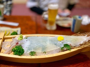 Close-up of fish served on table