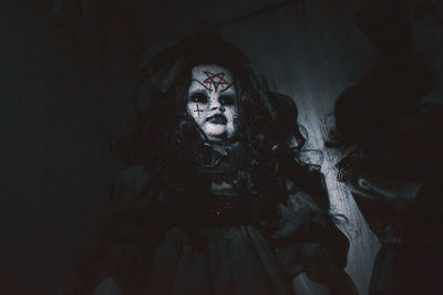 Human hand on face at home during halloween