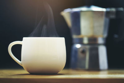 Close-up of coffee cup on table