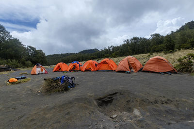 Tent on shore against sky