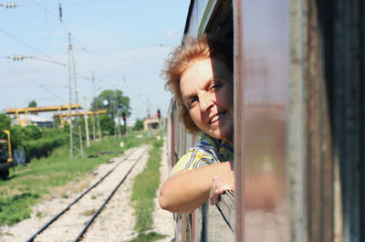 Retired senior woman sitting in train