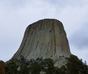 Low angle view of rock formation against sky