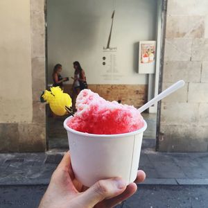 Hand holding ice cream