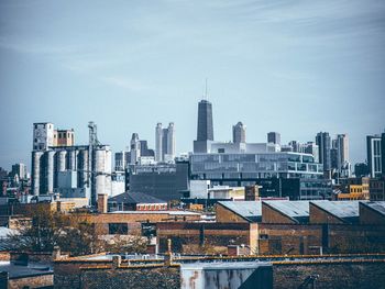 Midday chicago skyline against light whispy clouds viewed from the west