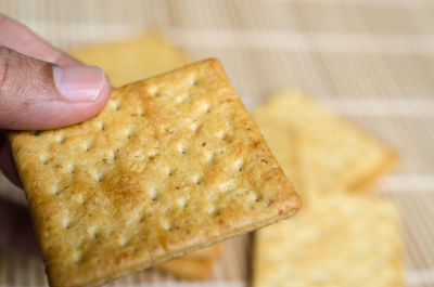 Close-up of hand holding bread
