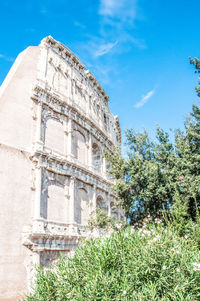 Low angle view of historical building against blue sky