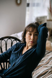Portrait of woman relaxing at home