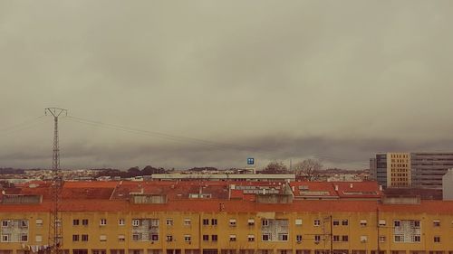 Buildings in city against sky