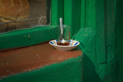 Close-up of drinking glass on window