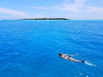 High angle view of man swimming in sea