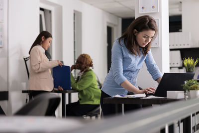 Business colleagues working in office