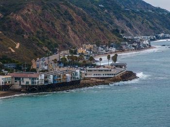 Scenic view of sea against mountain