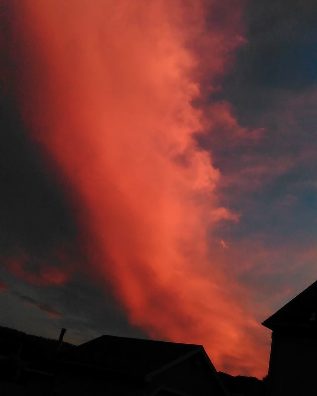 building exterior, architecture, sunset, built structure, sky, low angle view, cloud - sky, orange color, high section, cloudy, cloud, dramatic sky, residential structure, beauty in nature, building, nature, scenics, outdoors, weather, overcast, no people, tranquility, idyllic