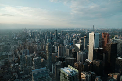 High angle view of modern buildings in city against sky