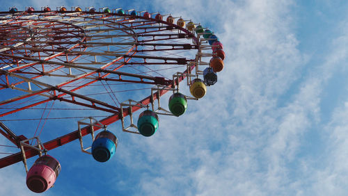 Low angle view of ferris wheel against sky