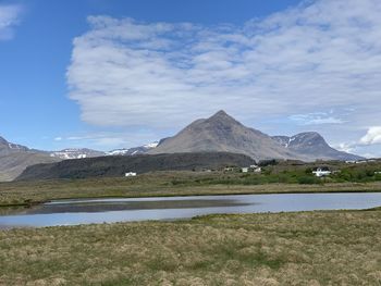 Scenic view of lake and mountains against sky