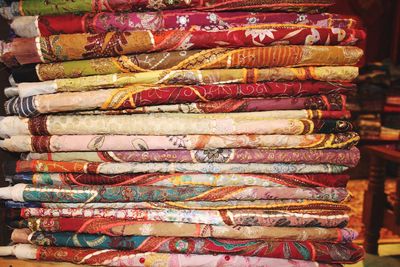 Stack of fabrics for sale in market