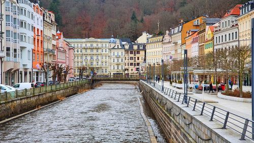 Canal amidst buildings in city