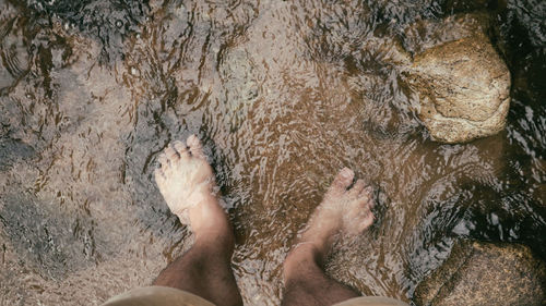 Low section of woman on water