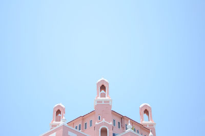 Low angle view of built structure against clear blue sky