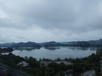 Panoramic view of trees and mountains against sky