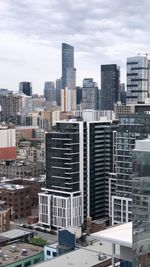 Buildings in city against sky