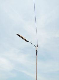 Low angle view of street light against sky