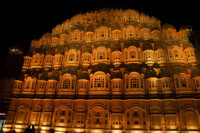 Low angle view of illuminated building at night