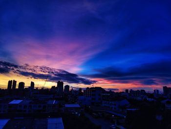 High angle view of buildings against sky during sunset