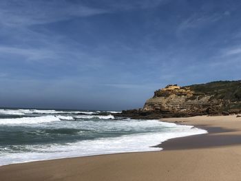 Scenic view of beach against sky