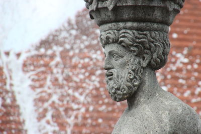 Low angle view of statue against temple