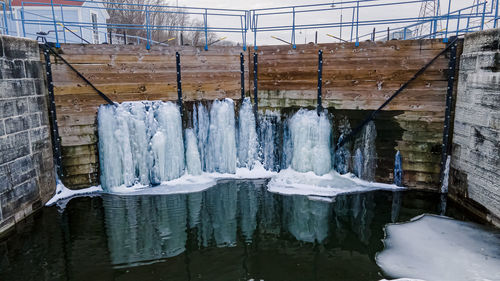 Water leaks through these canal doors creating frozen formations along the doors.