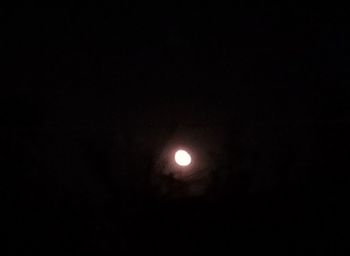 Low angle view of moon against sky at night