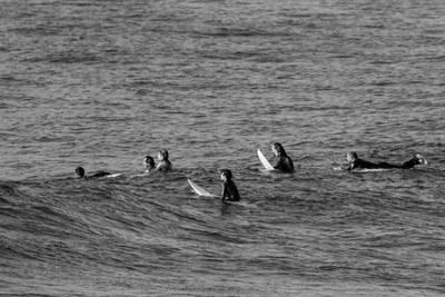 People swimming in sea