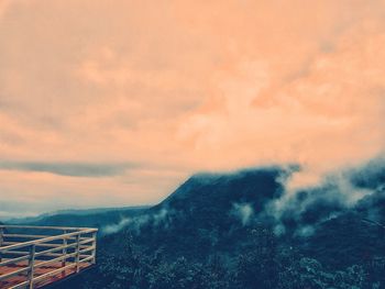 Scenic view of mountains against sky at sunset