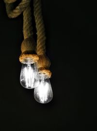 Low angle view of illuminated light bulb