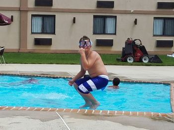 Full length of boy in swimming pool