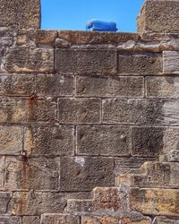 Low angle view of brick wall