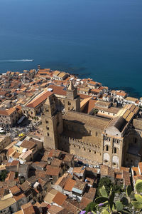 High angle view of townscape by sea