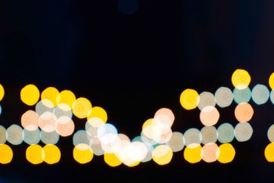 Defocused image of illuminated christmas lights